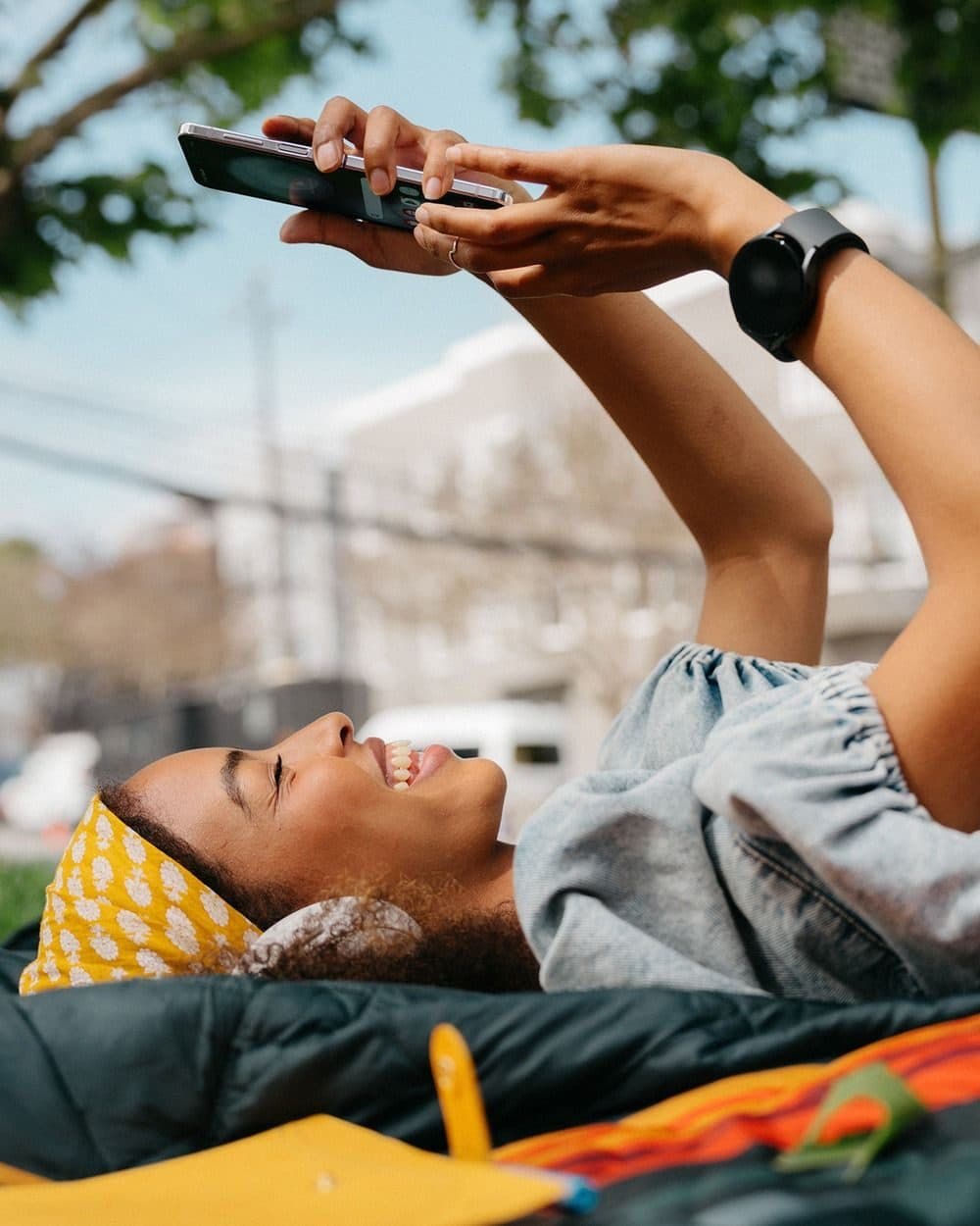 Customer happily browsing a store from her phone outdoors